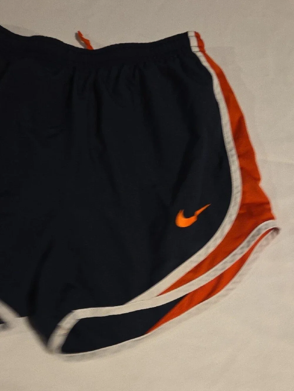Nike Women’s Navy Athletic Shorts with Orange and White Trim